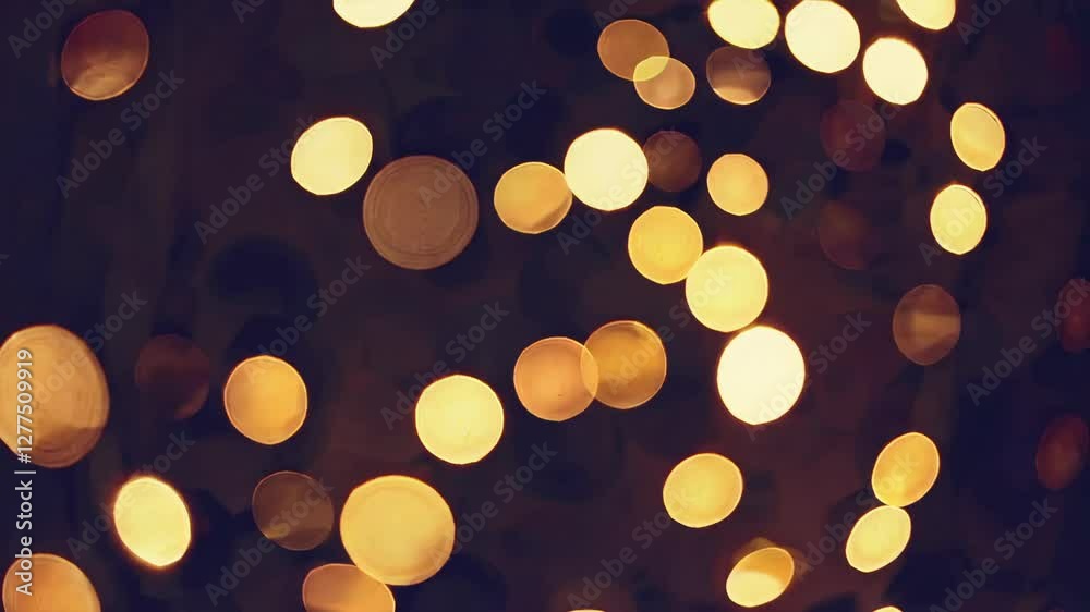 Poster warm golden bokeh light spots on dark background, creating an abstract and festive atmosphere. celeb