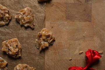 Overhead view of nigerian coconut candy, top view of candied coconuts discs, flatlay of bukayo candy or coconut drops	