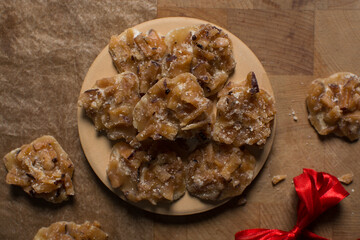 Overhead view of nigerian coconut candy, top view of candied coconuts discs, flatlay of bukayo candy or coconut drops