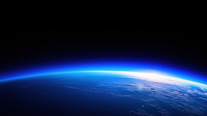 Glowing blue Earth horizon illuminated by the sunrise