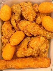 Crispy Korean fried chicken, perfectly glazed with a sweet and spicy sauce. Ideal for food photography and menus, showcasing the irresistible crunch and flavor of this beloved dish.
