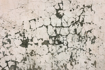 Crack wall texture. Cracked concrete wall covered with cement surface as background. Wall fragment with scratches and cracks