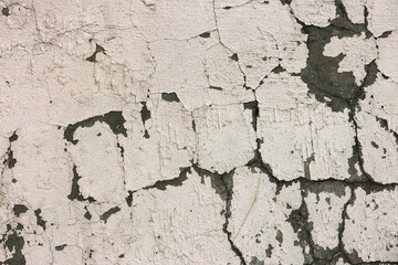 Crack wall texture. Cracked concrete wall covered with cement surface as background. Wall fragment with scratches and cracks