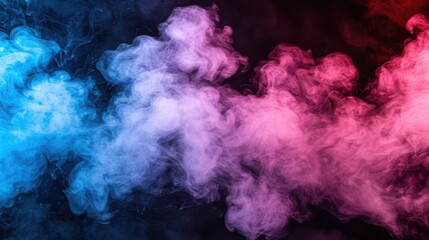Fototapeta premium A vibrant mix of blue and pink smoke against a dark background, creating a mesmerizing and dynamic visual effect.