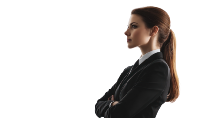 A confident businesswoman stands in profile, showcasing her professionalism and determination. Ideal for corporate or empowerment themes.