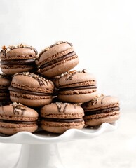 Delicious Chocolate Macarons on a White Display Stand