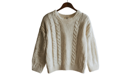 A cozy knit sweater hanging on a wooden hanger, perfect for the fall and winter seasons, showcasing warm and stylish fashion trends.