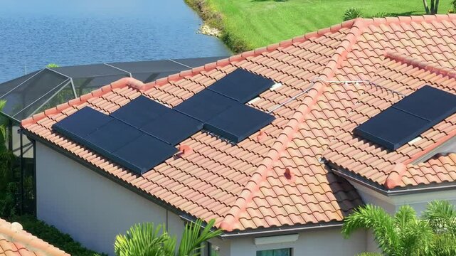 American building roof with rows of blue solar photovoltaic panels for producing clean ecological electric energy. Renewable electricity with zero emission concept