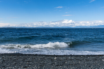 panorama view from the shore of Malcolm Island beautiful water of the ocean with clouds on blue sky