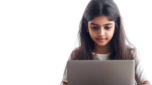 A young girl focused on her laptop, representing modern learning and digital engagement. Perfect for themes of education, technology, and youth.