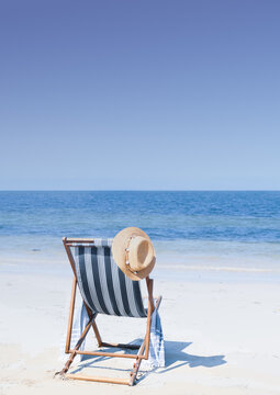 Sun chair and sun hat at the beach