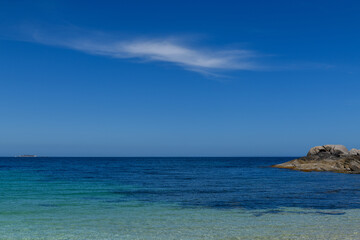 The beach on an isolated island and one lonely cloud