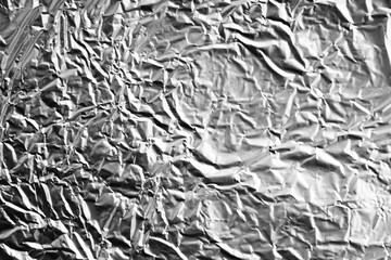 Crumpled silver plastic texture. Vintage scratched grunge background. Space for text.