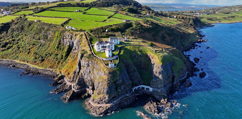 Aerial view of Blackhead Lighthouse on the beautiful and spectacular coastline of the Glens of...