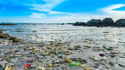 Plastic waste, plastic cups at the beach. Concept of environmental problems and saving the planet.