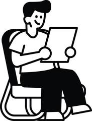 man is sitting in a chair and reading a piece of paper