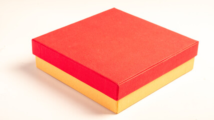 An open gift box with a red textured lid and a brown kraft paper base, placed on a clean white background, symbolizing love, surprises, and special occasions like Valentine's Day