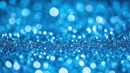 A mesmerizing close-up of shimmering blue glitter, creating a sparkling effect that enhances creative and artistic designs. Perfect for backgrounds.