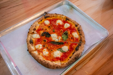 The beauty of a Neapolitan pizza lies in its simplicity—just dough, tomatoes, mozzarella, and love