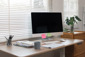 Computer monitor, screen isolated on white background at workplace office room with decorations and copy space modern 
