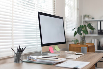  Desktop computer Blank screen PC in minimal workplace office room with decorations and copy space modern 
