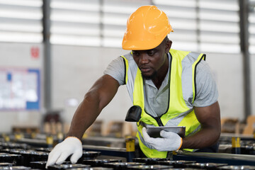 Distribution warehouse, Multi-ethnic workers, Product barcode scanner, African American male...