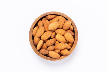 Almond nuts in Wooden bowl isolated on white background top view