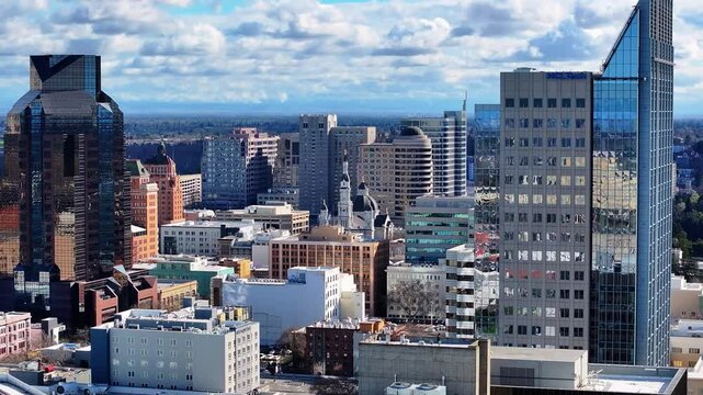 A cinematic 3x zoom drone orbit over downtown Sacramento, capturing the skyline with a compressed perspective. Smooth, high-resolution footage perfect for cityscapes, B-roll, and commercial use.