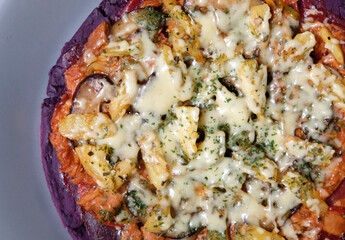 Close-up of homemade purple sweet potato pizza.