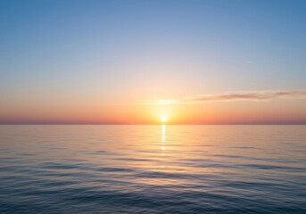 Obraz premium Tranquil sunset over calm ocean waves with vibrant sky reflections