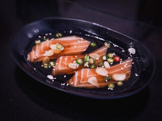 Salmon raw pickled in shoyu sauce or soy sauce