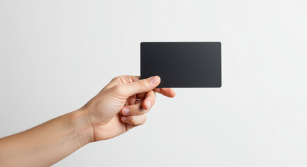 Hand holding business card. Hand holding a black card. Business card in hand