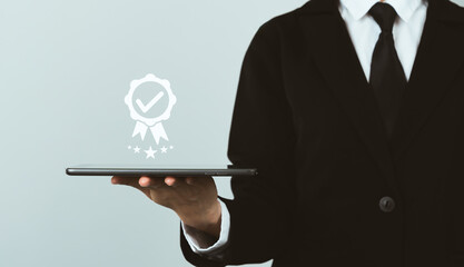 Businessman hand showing the best quality and five star for guarantee good service.