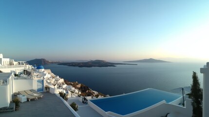 Obraz premium A panoramic view of Santorini, Greece, with white buildings and blue domes overlooking the sea, a clear sky, and a Greek island background