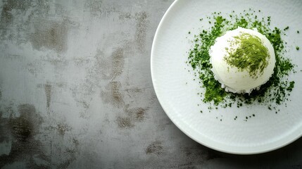 A white plate with a green topping on it