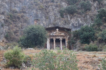 View of the Tomb of Amyntas in Fethiye, Mugla, Turkey. The Lycian Rock Tombs at ancient Telmessos currently in Fethiye is a popular tourist attraction in Turkey.