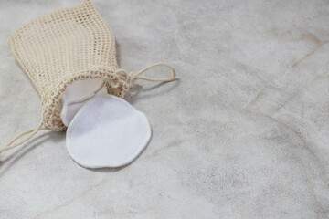 reusable cotton pads on a plain background
