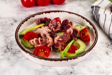 Salad with baby octopus and avocado