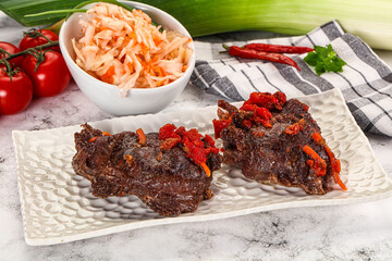 Baked beef cheeks with vegetables