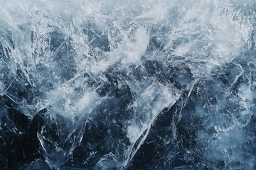 A dramatic close-up of a frozen body of water with deep, dark tones and subtle ripples. The contrast between light reflections and icy textures creates a moody and mysterious aesthetic