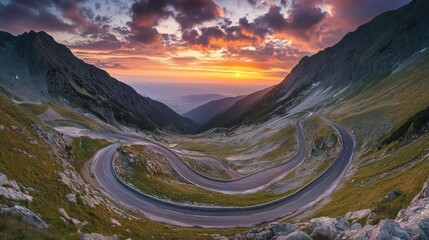 Winding road through a mountain pass at sunset
