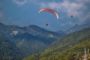 Paragliding over the clouds sunset view at Bir Billing Himachal Pradesh India. Clouds in the sky