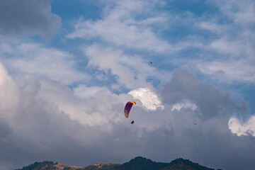 Paragliding over the clouds sunset view at Bir Billing Himachal Pradesh India. Clouds in the sky