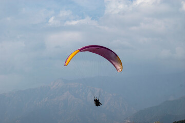 Paragliding over the clouds sunset view at Bir Billing Himachal Pradesh India. Clouds in the sky,
