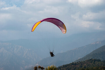 Paragliding over the clouds sunset view at Bir Billing Himachal Pradesh India. Clouds in the sky,