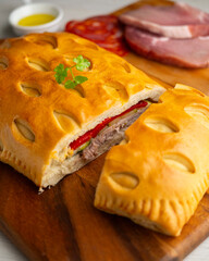 Spanish Hornazo. Traditional Spanish pie filled with Iberian pork loin and other ingredients such as sausages or vegetables.