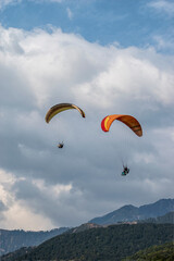Paragliding over the clouds sunset view at Bir Billing Himachal Pradesh India. Clouds in the sky