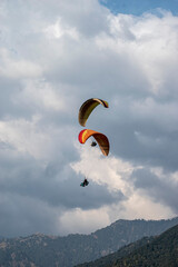 Paragliding over the clouds sunset view at Bir Billing Himachal Pradesh India. Clouds in the sky