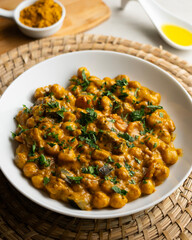 Chickpea curry with eggplant, a traditional Indian vegan recipe.