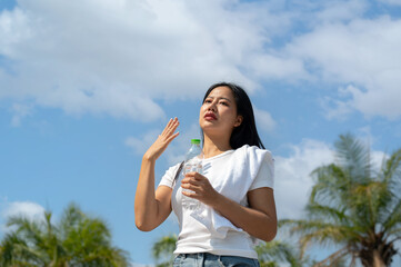 A beautiful women feeling uncomfortable after running under the sun.